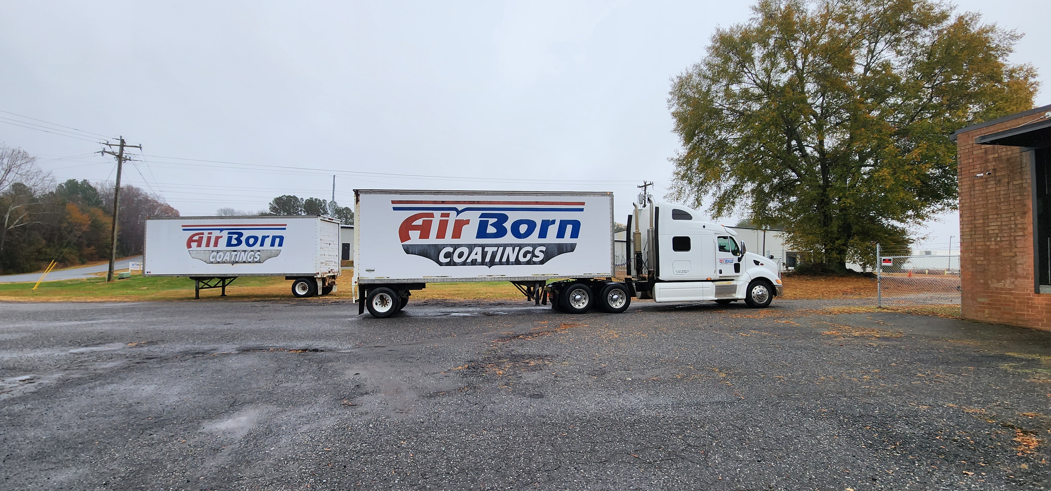 AirBorn coating fleet trucks parked outside the North Carolina manufacturing facility.