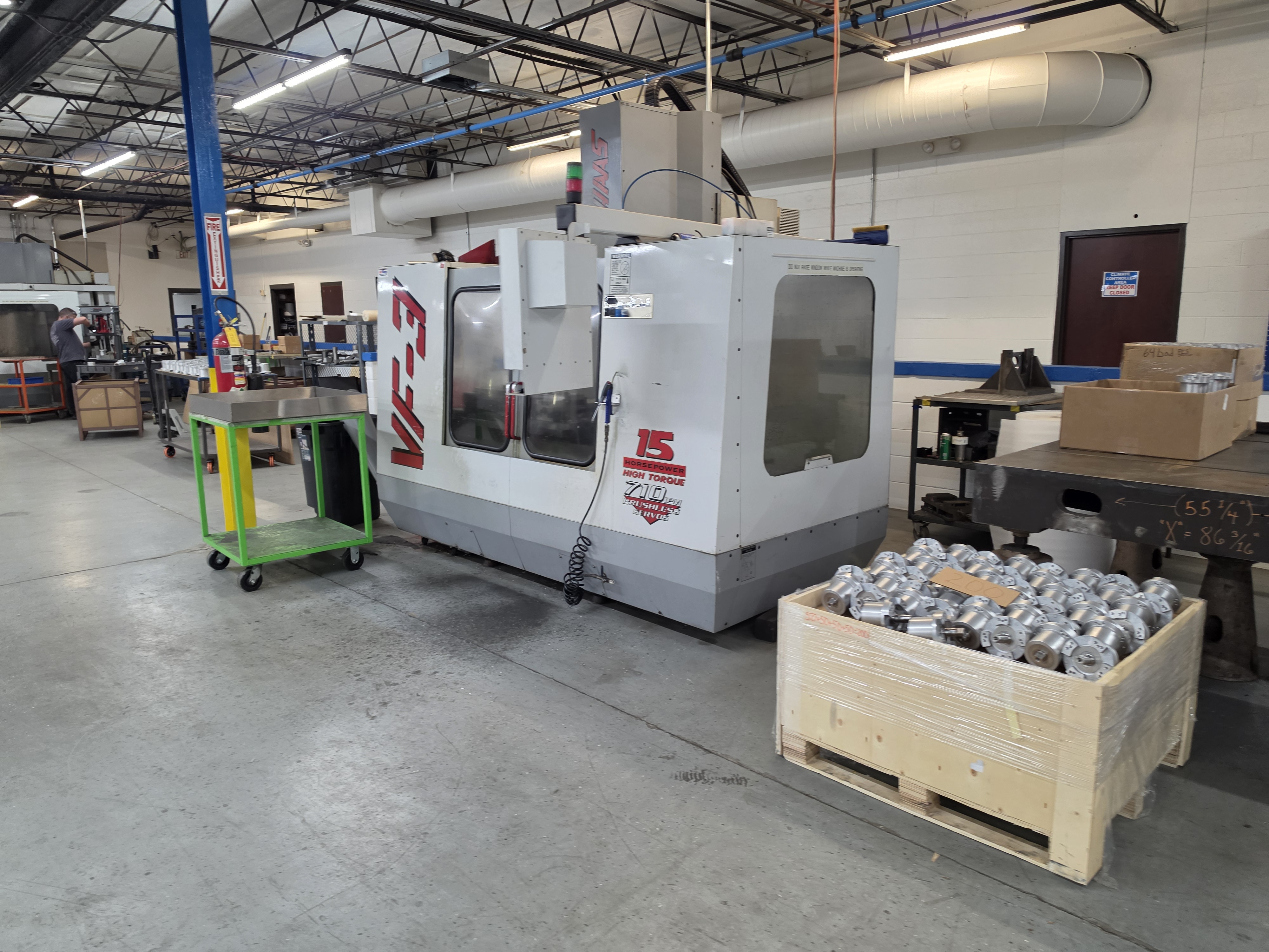 AirBorn Manufacturing CNC shop equipment with material staged for production.