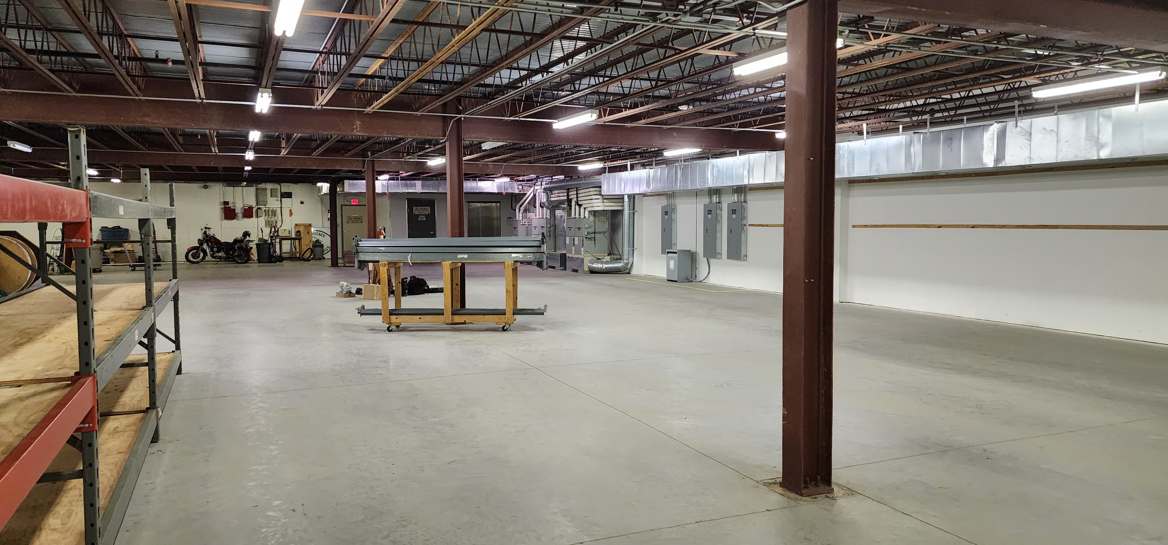Open AirBorn Manufacturing shop floor production area with equipment and work space.