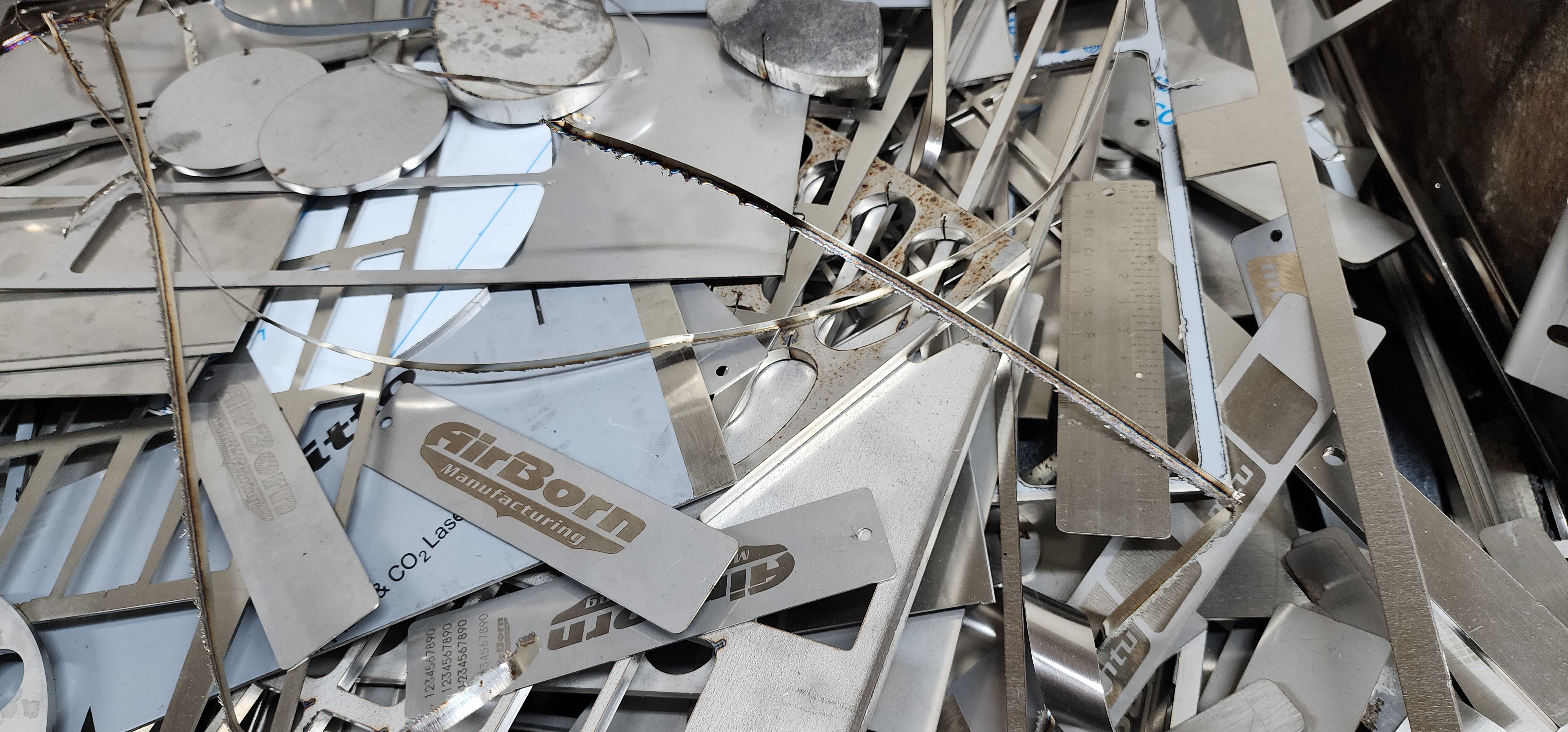 Fabricated metal scrap and shop parts after cutting and fabrication work.