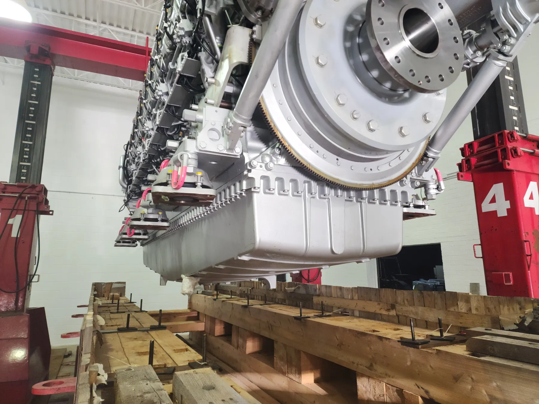 Large engine component staged for production support work in a shop.