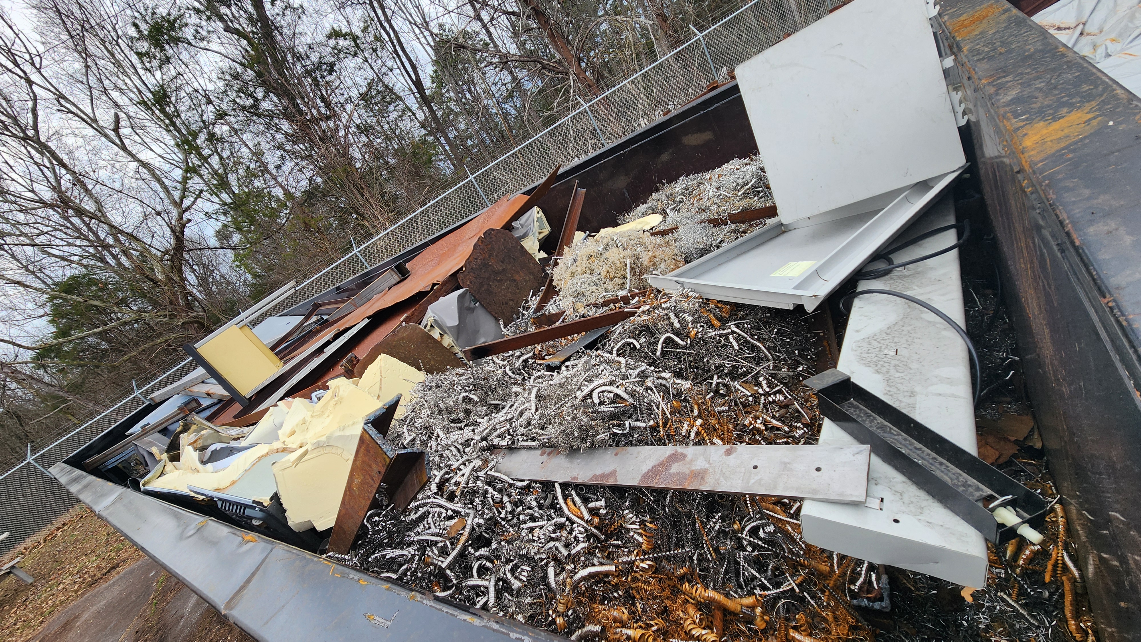 Metal fabrication scrap and nesting remnants from cut sheet material.