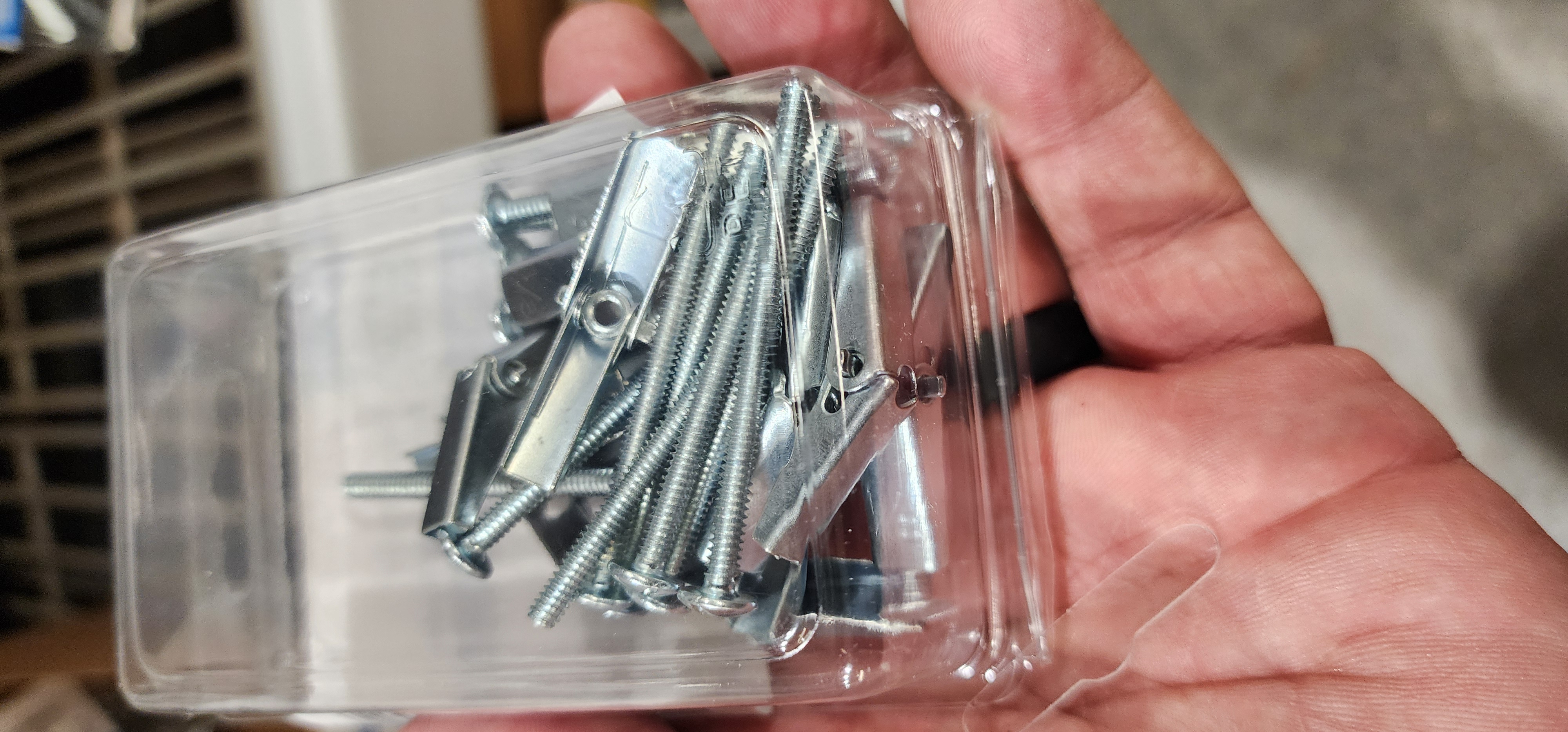 Packaged metal fasteners held for assembly and kit preparation.