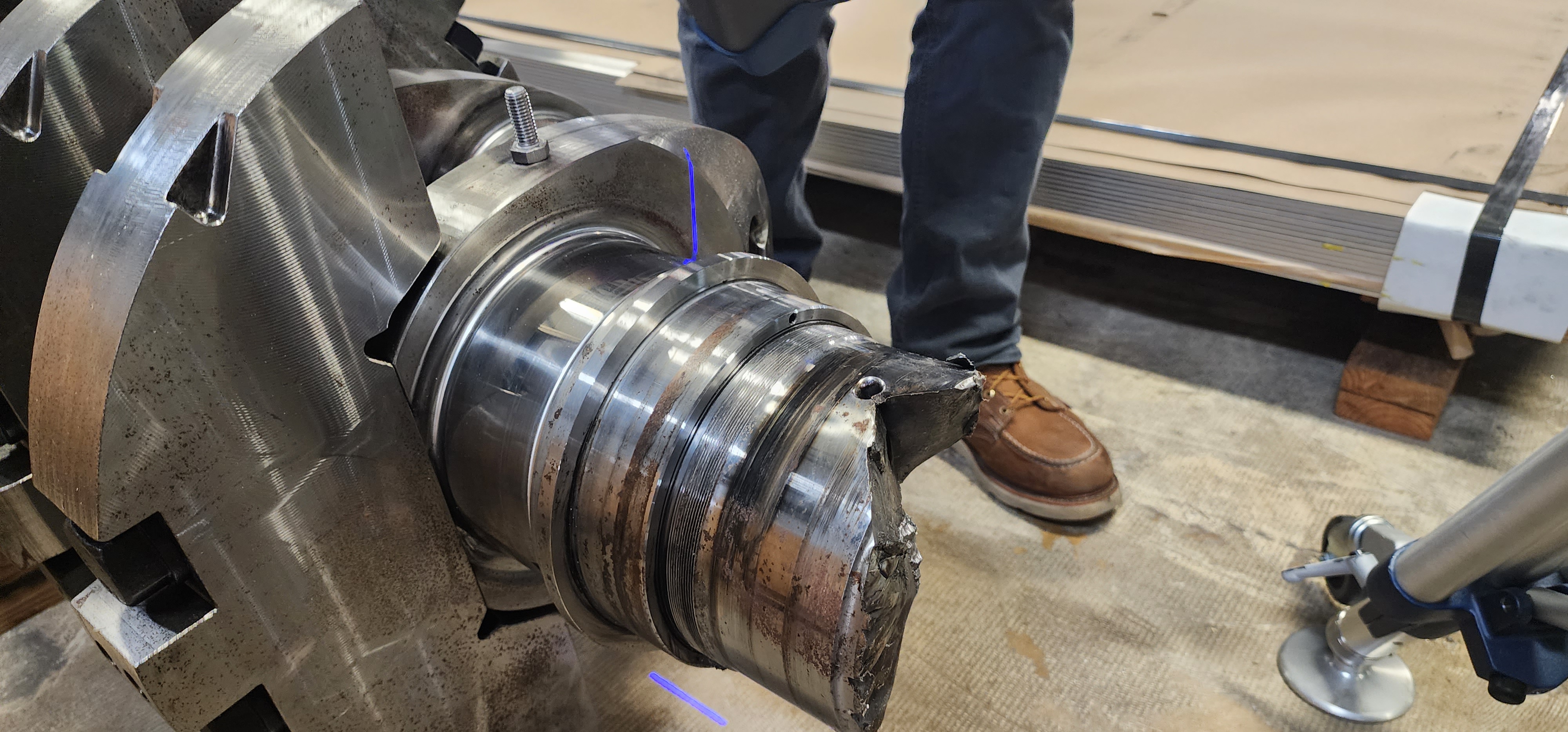 Close view of a precision machined metal shaft with turned features.