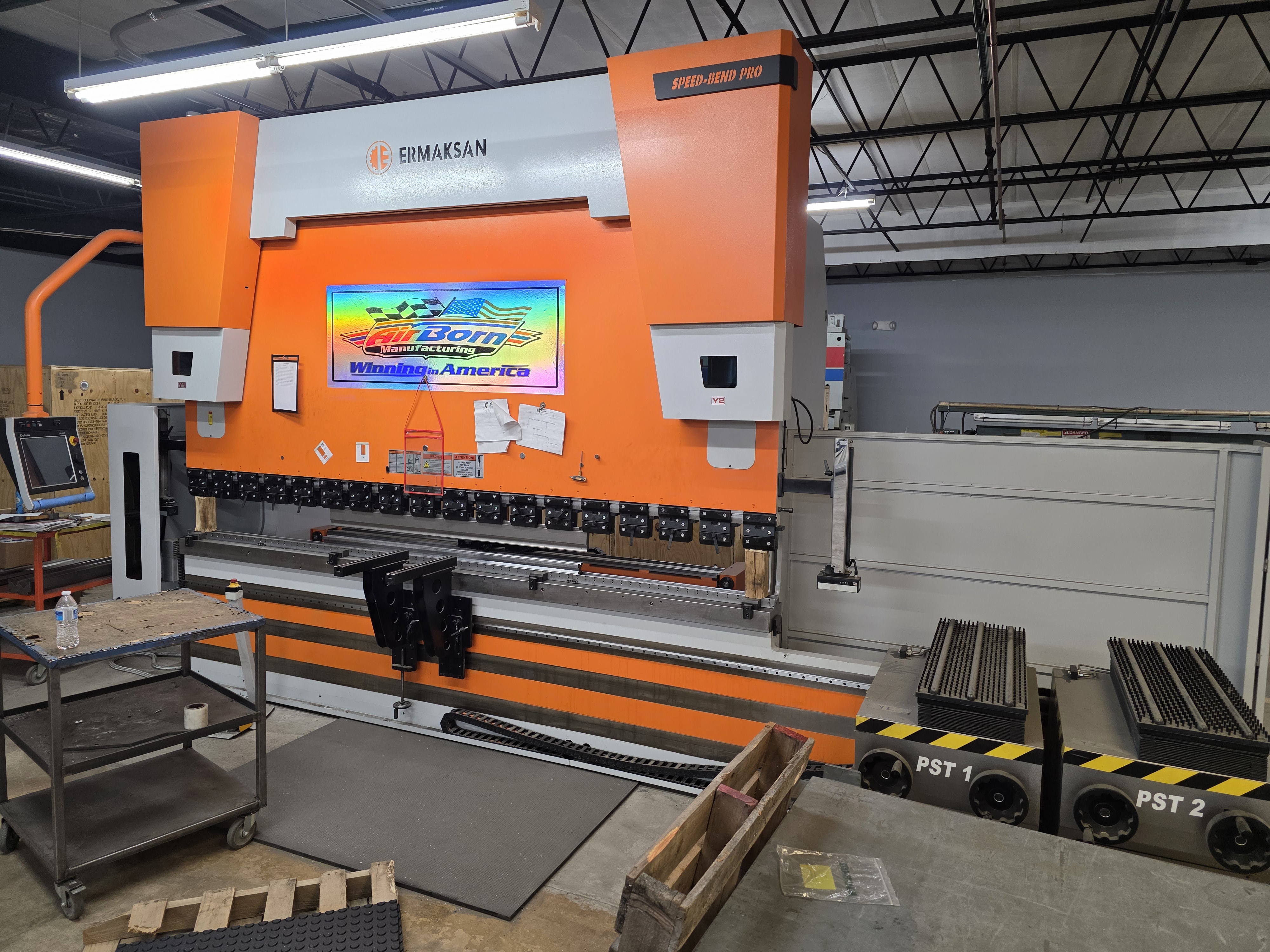 Press brake forming equipment used for sheet metal fabrication at AirBorn Manufacturing.