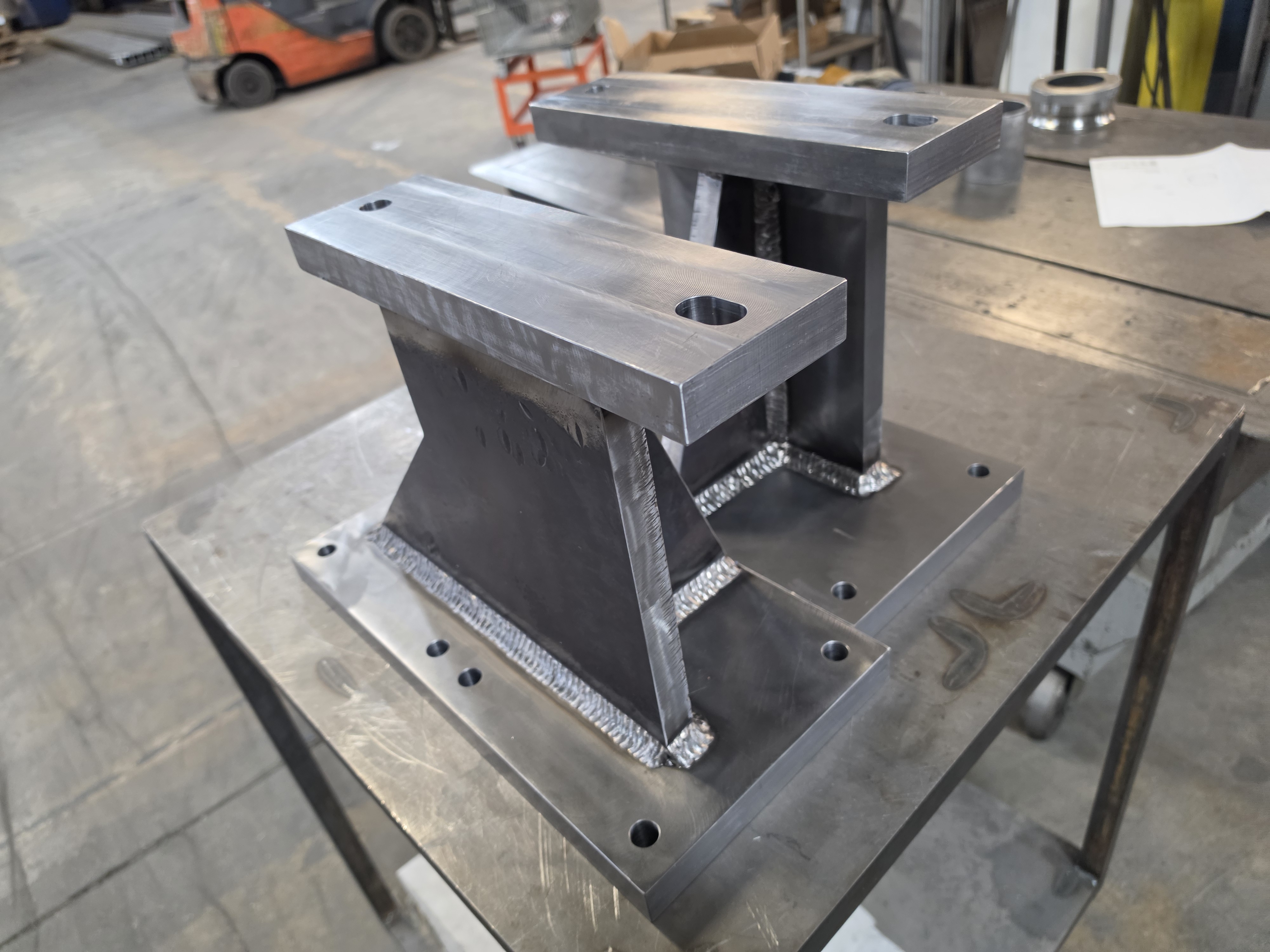 Welded steel table frame assembly on the AirBorn Manufacturing shop floor.